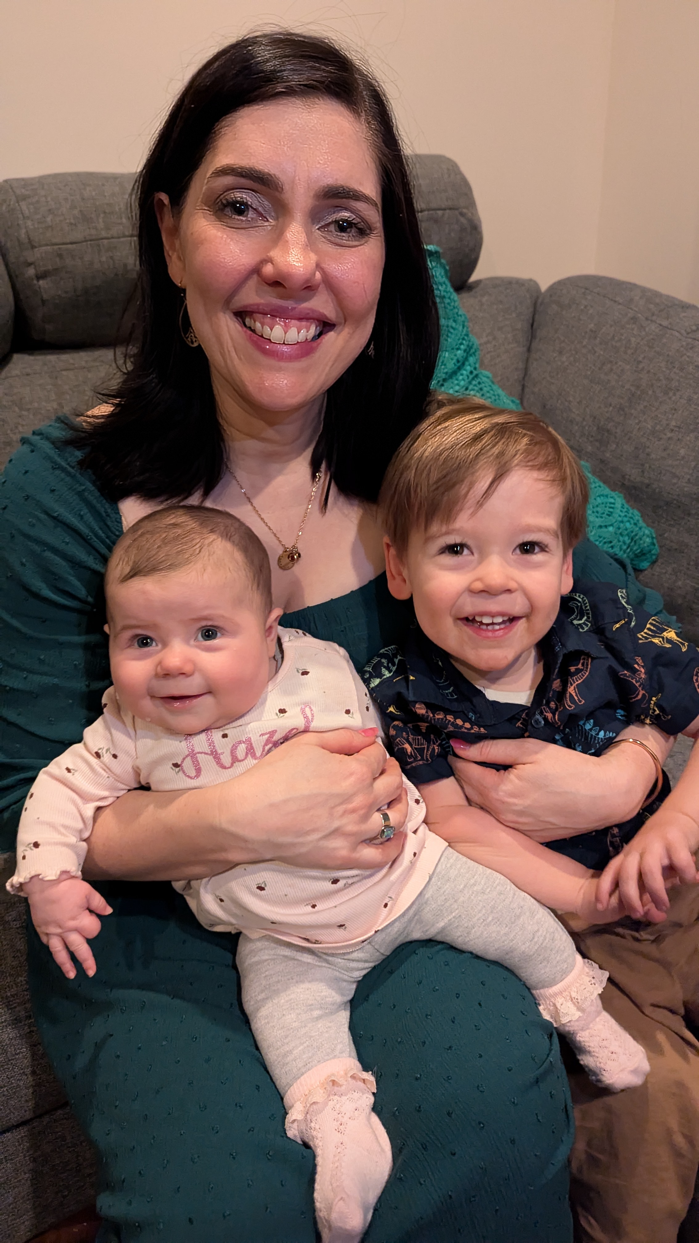 Mum and two kids on her lap