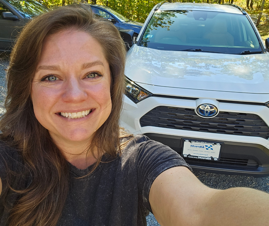 Christi Nicolet Standing in front of her new vehicle, after months of looking and planning 