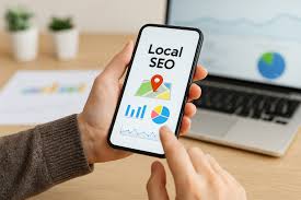 a person holding a cellphone with the words Local SEO on the screen