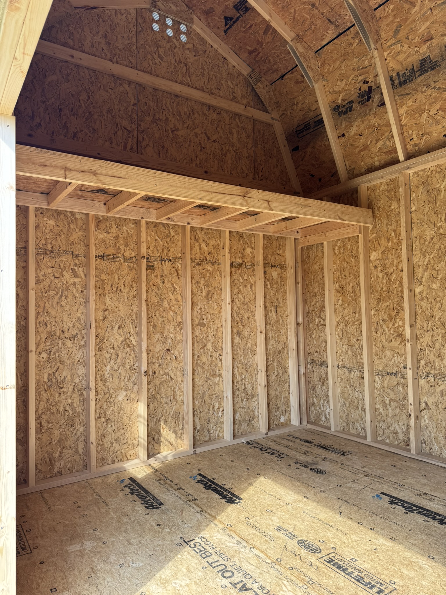 Loft in custom outdoor portable building for extra storage