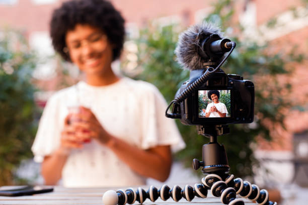 The warm cityscape backdrop hints at a relaxed setting. 🎥🌆