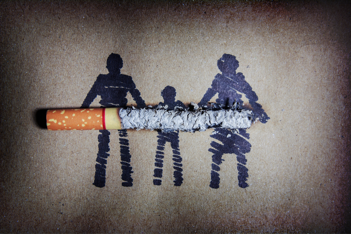 Cigarrillo consumido simbolizando el impacto del tabaquismo en la familia y los no fumadores. Cigarrillo consumido simbolizando el impacto del tabaquismo en la familia y los no fumadores.