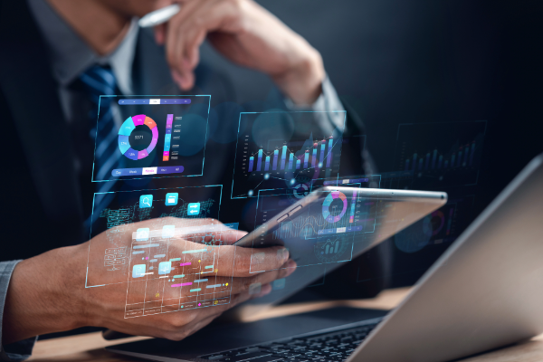 A leader analyzing organizational network analysis (ONA) data on a laptop, highlighting the importance of data-driven team restructuring. A leader analyzing organizational network analysis (ONA) data on a laptop, highlighting the importance of data-driven team restructuring.