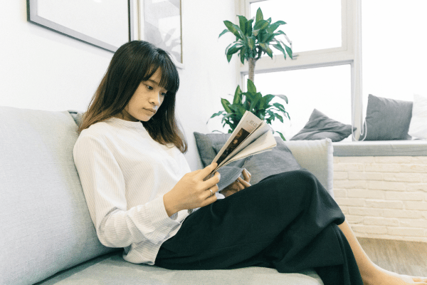 Woman reading magaine Woman reading magaine