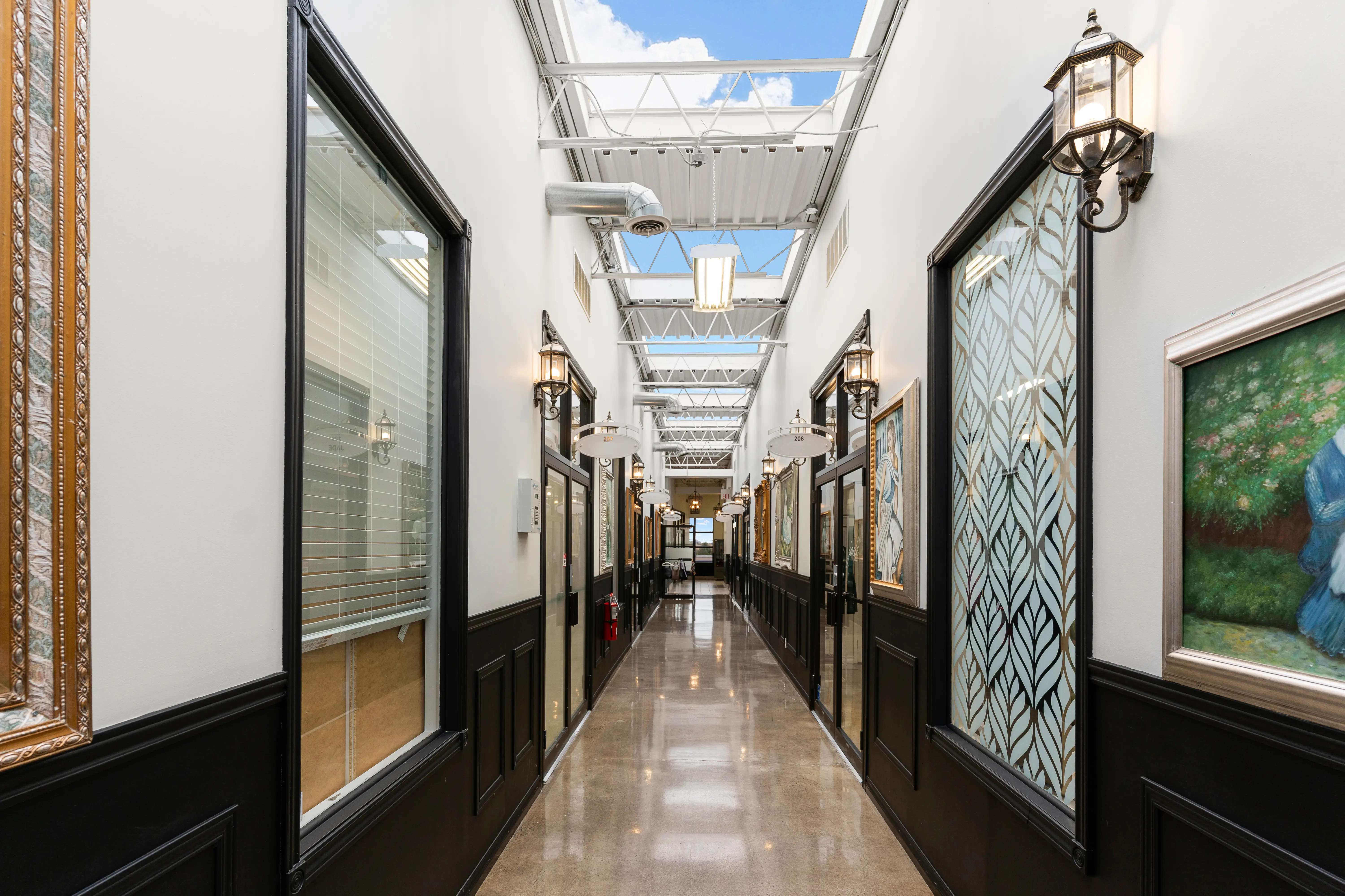 Modern office environment with bright lighting and glass interiors at FayLaura Investments