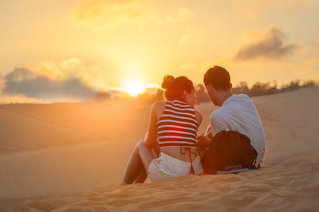 Couple watching sunset used in blog post by Carli Thorpe