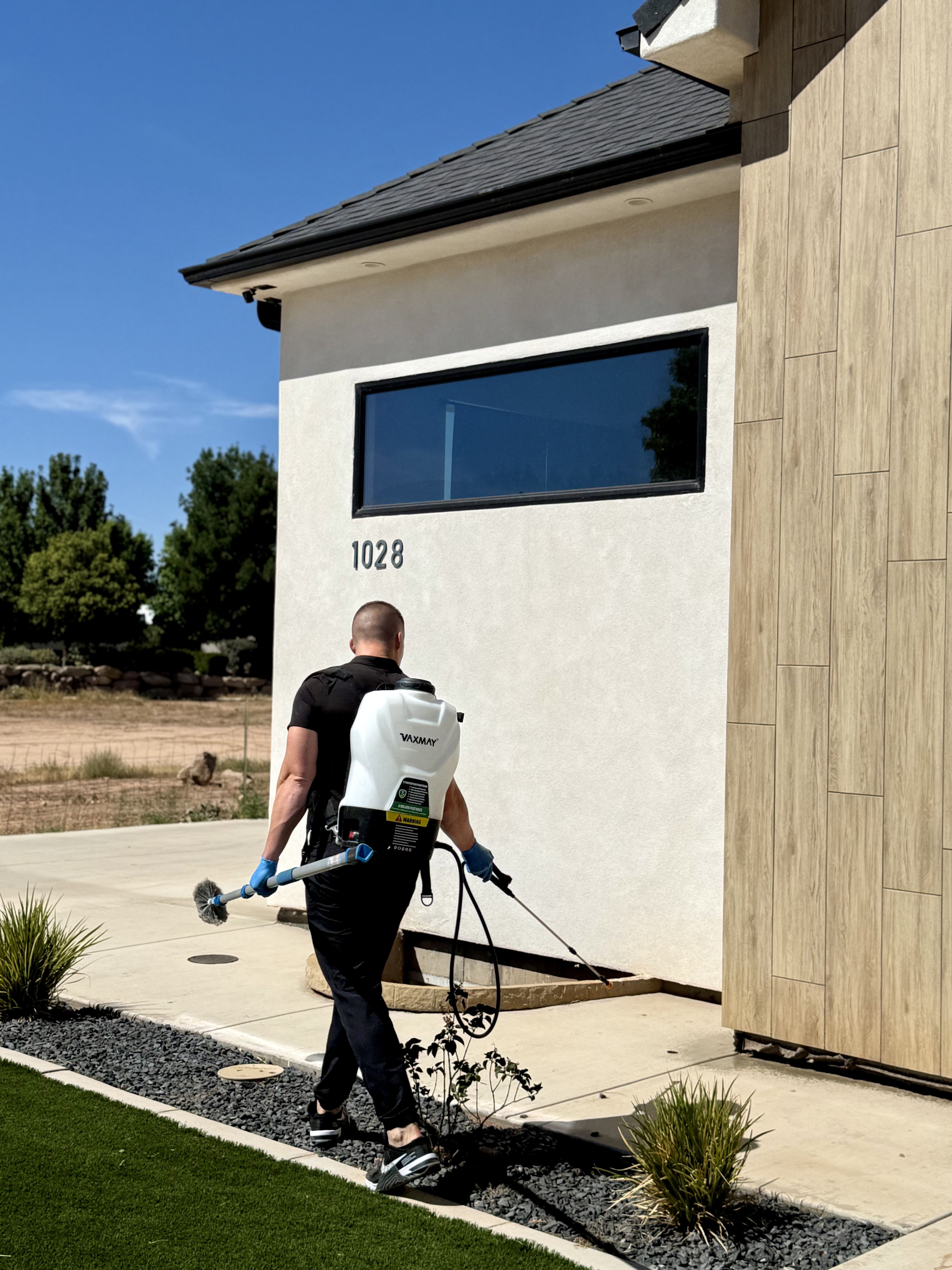 Bamboo Pest Control technician treating a Southern Utah home