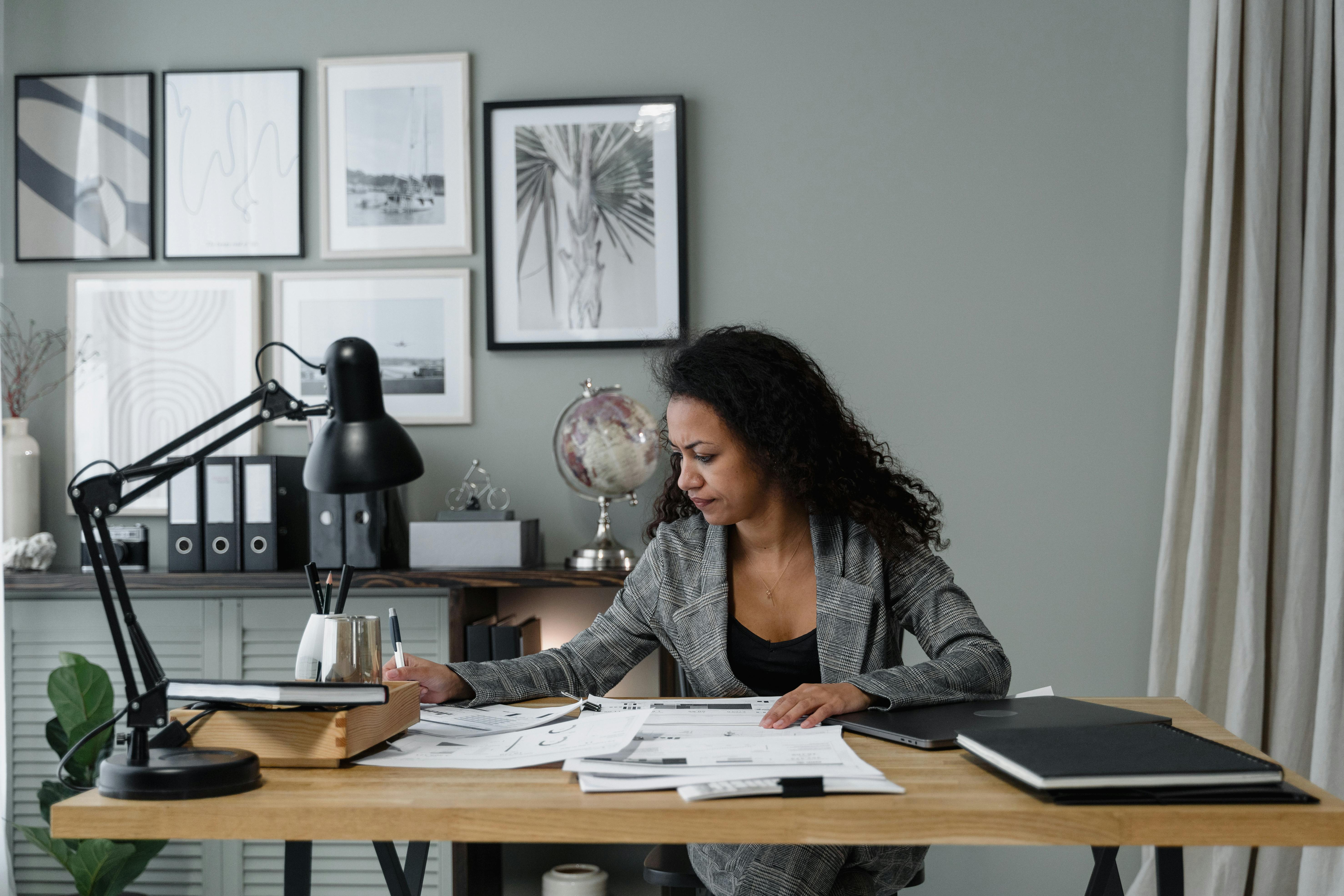 Title officer at a desk reviewing a property’s chain of title.