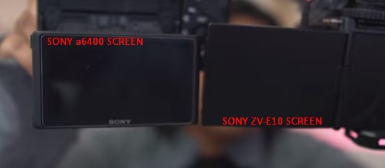 Diana holding both screens for the Sony ZV-E10 Mark 1 vs the Sony a6400 camera next to each other