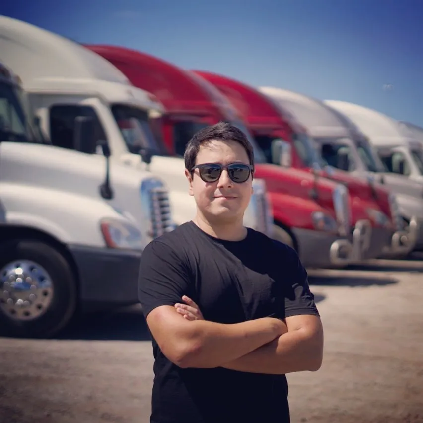 CDL Empire investor testimonial - Investment Banker with 6-truck portfolio achieving 18.1% average ROI