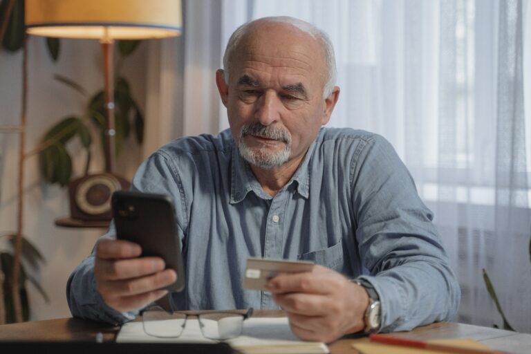 Man using a credit card to make a purchase online