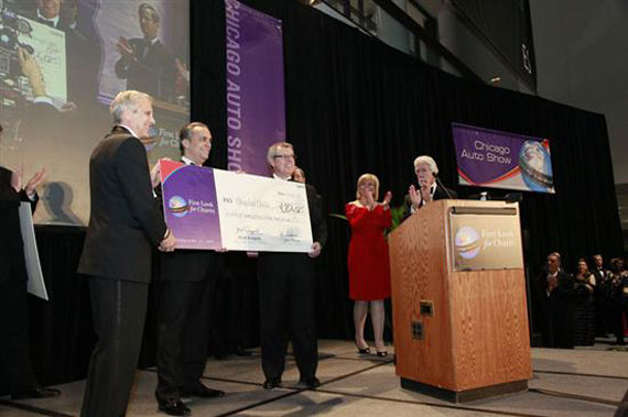 CATA President Jerry Cizek, III, 2009 Auto Show Chairman Mark Scarpelli, and 2009 CATA Chairman John Phelan present the check from First Look for Charity.