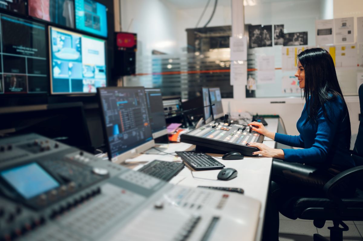 woman monitoring data in sleek control room