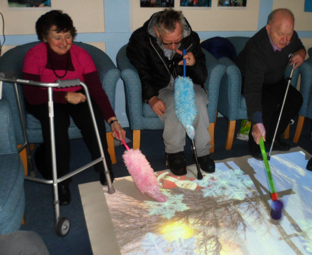 elderly using interactive projection system on floor elderly using interactive projection system on floor