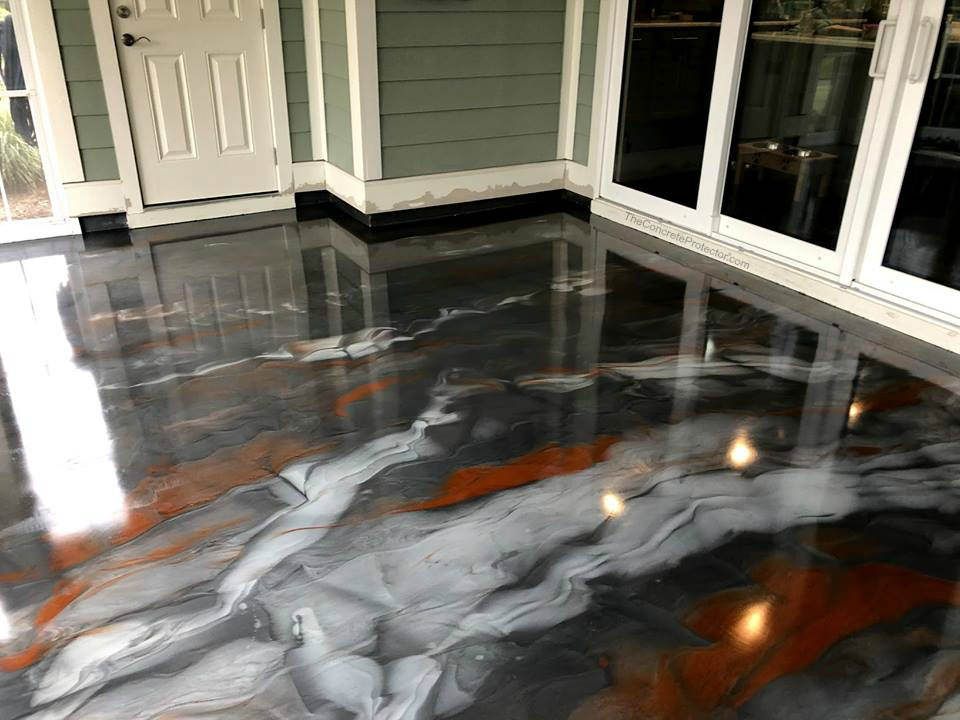 A white car in a garage with a finished floor