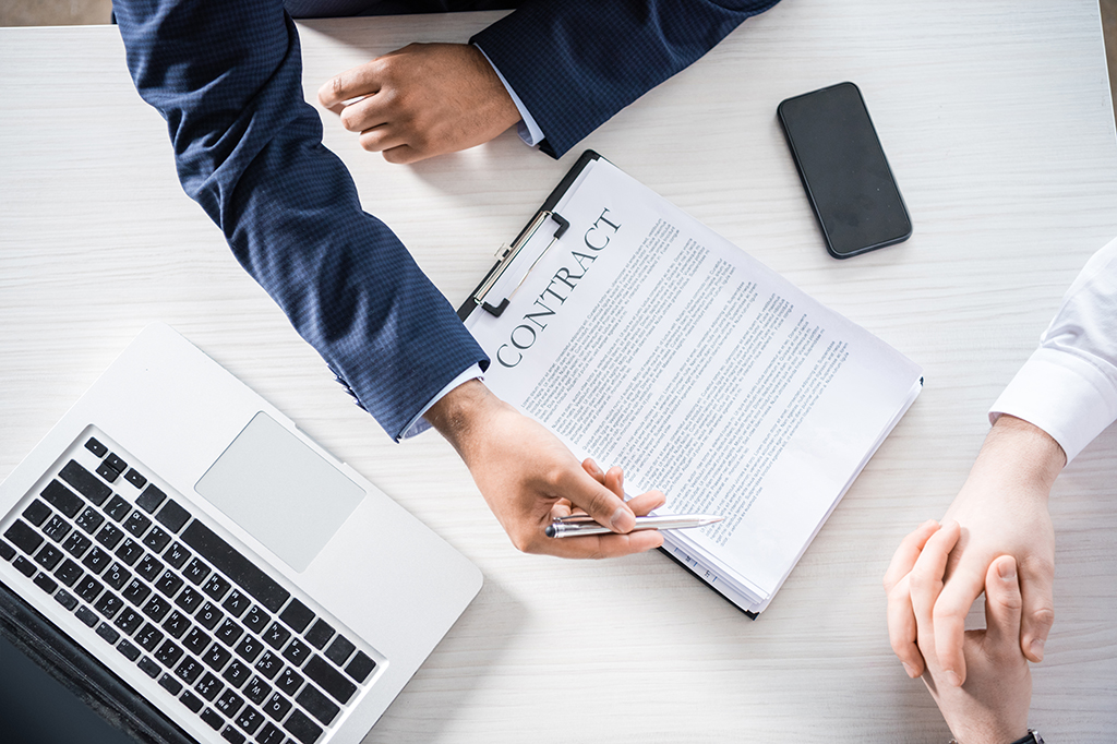 A business owner and a managed IT provider go over a Service-Level Agreement (SLA)