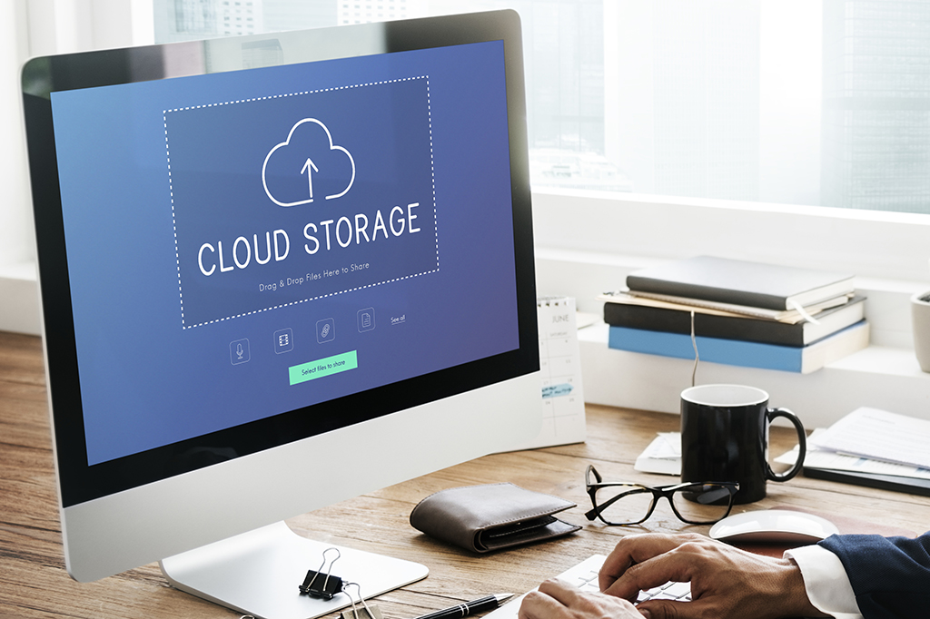 A nonprofit leader uploads files to share on a cloud server A nonprofit leader uploads files to share on a cloud server