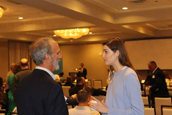 Sarah Blakemore, student at UT Austin and protégé of Dr. Marty Makary, speaks with Dave Campbell, Chairman of San Antonio Manufacturers Association