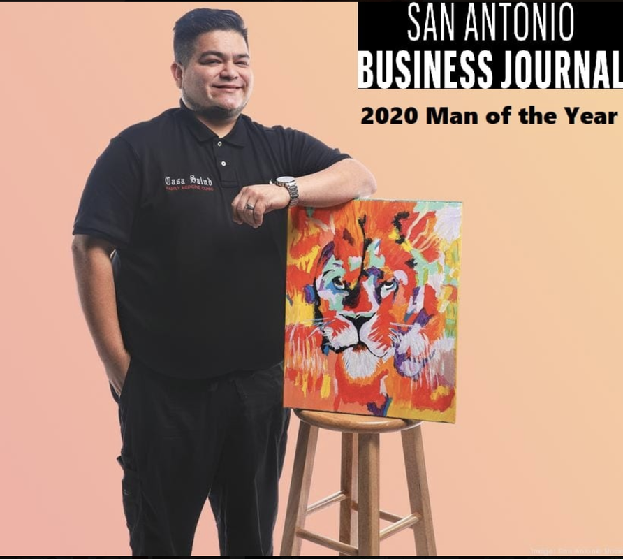 Dr. Ray Altamirano, San Antonio Business Journal 2020 Man of the Year, standing next to his lion portrait