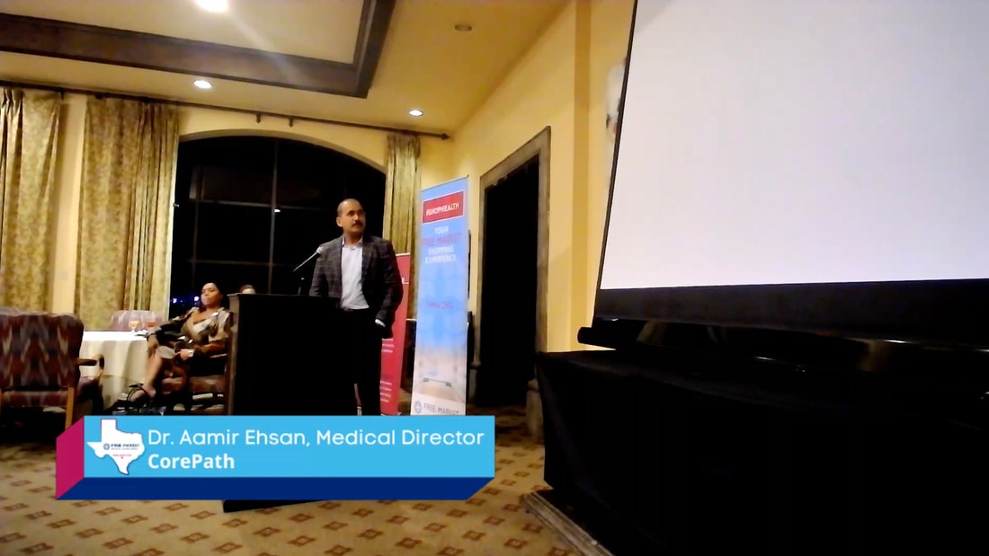 Dr. Aamir Ehsan of CorePath Laboratories facing projector.