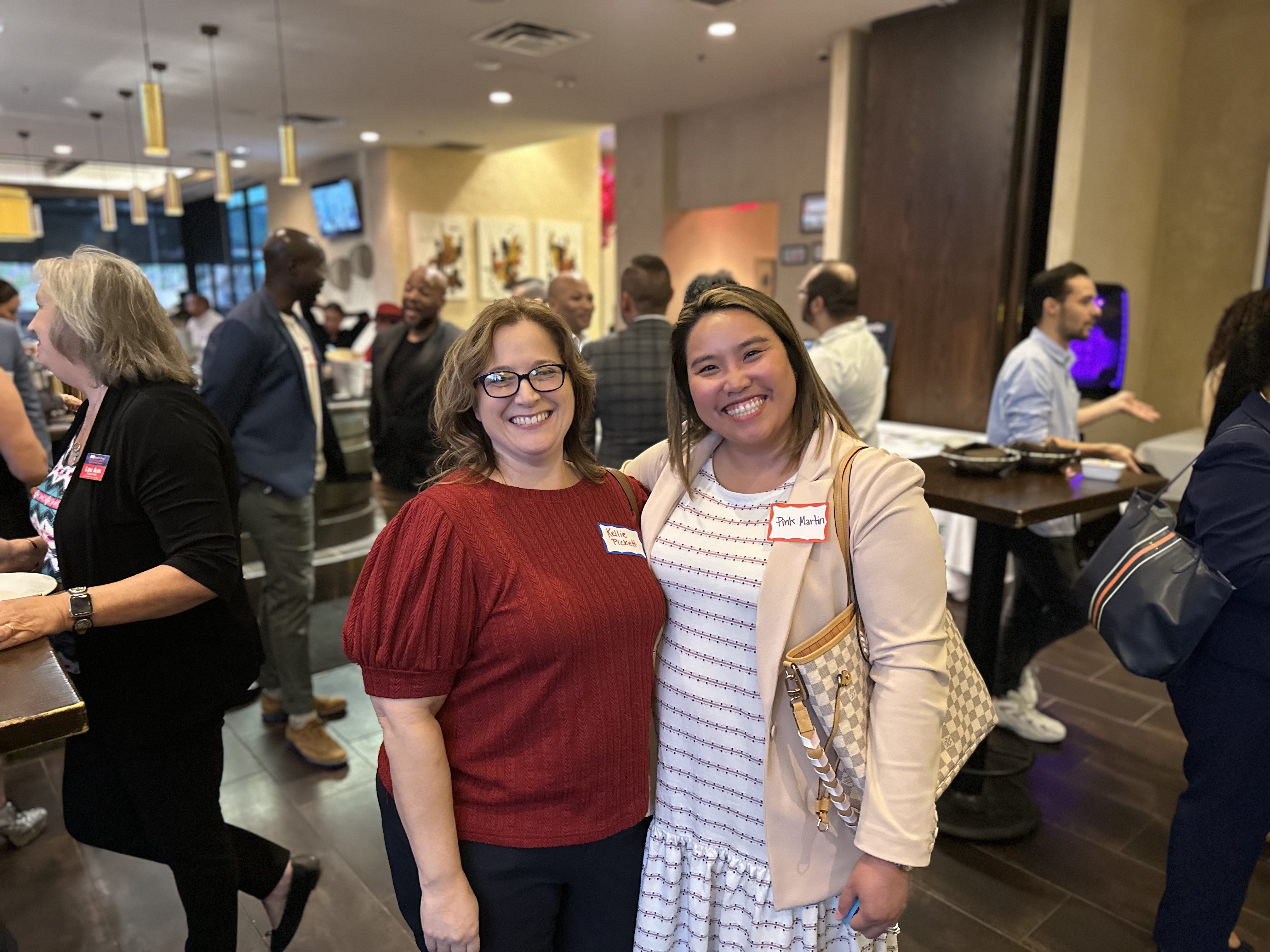 Kellie Pickett and Dusadee "Pink" Martin pose for a photo at the San Antonio Free Market Medical Association End of Summer Mixer