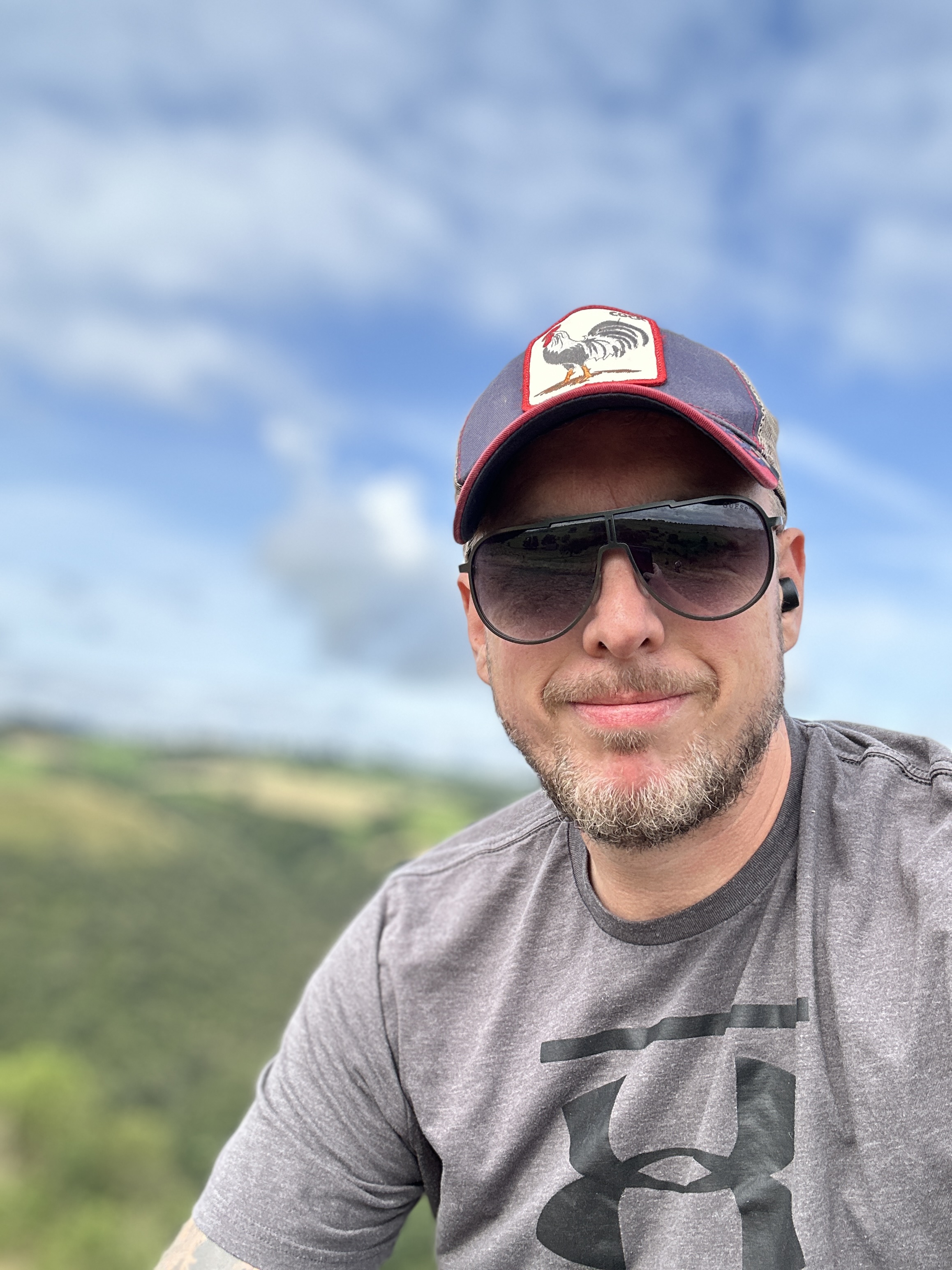 Image of fraser nicoll sitting in a field with a smile to support blog post Benefits in an adult ADHD diagnosis and why it is important Image of fraser nicoll sitting in a field with a smile to support blog post Benefits in an adult ADHD diagnosis and why it is important