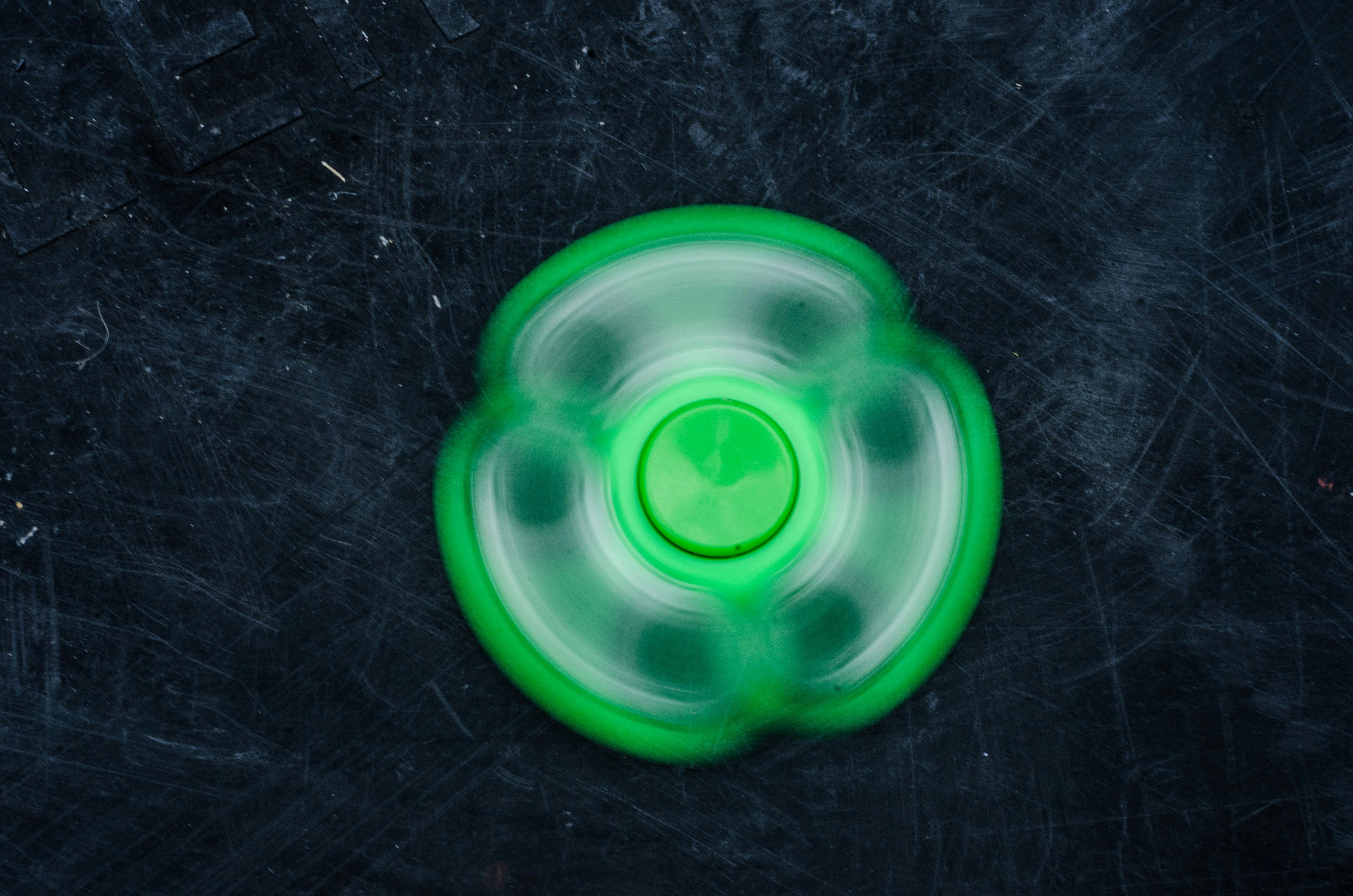 Spinning fidget in green to support blog post Is OCD Considered to be Linked to Neurodivergent People?