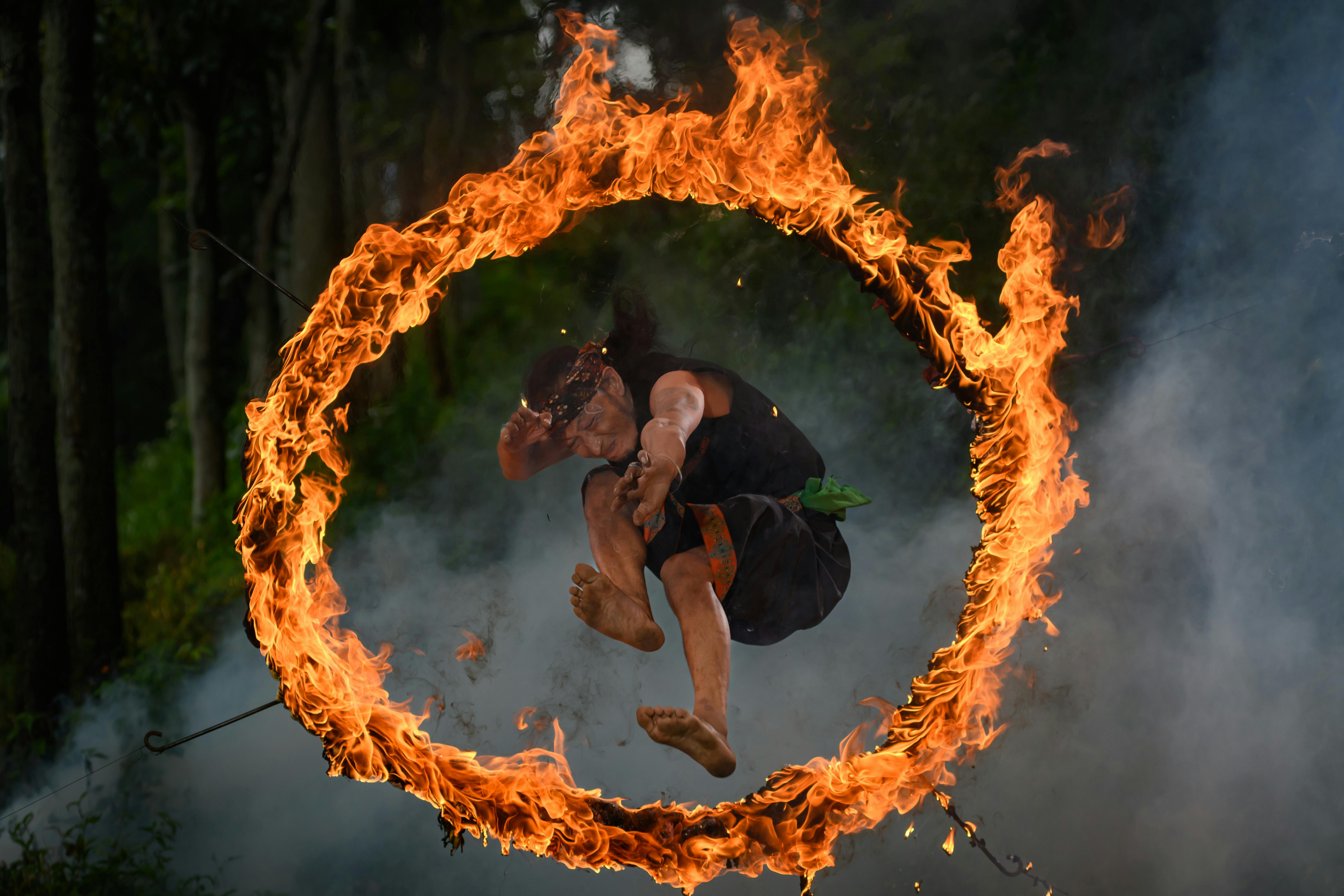 Man jumping through hoop of fire to support blog post Benefits in an adult ADHD diagnosis and why it is important Man jumping through hoop of fire to support blog post Benefits in an adult ADHD diagnosis and why it is important