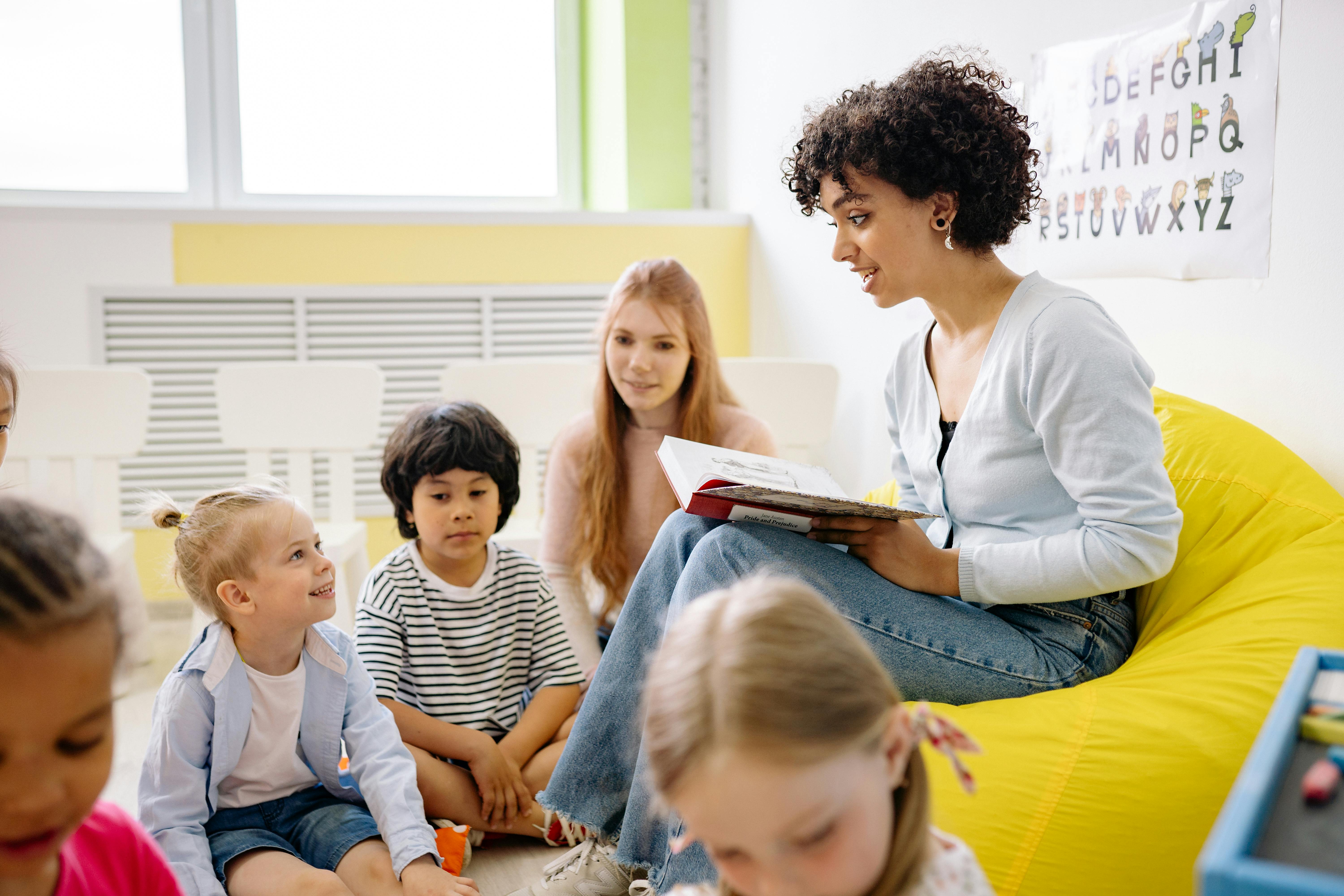 Teacher reading to group of children to support blog post Understanding ADHD, Autism and Aphantasia Connection