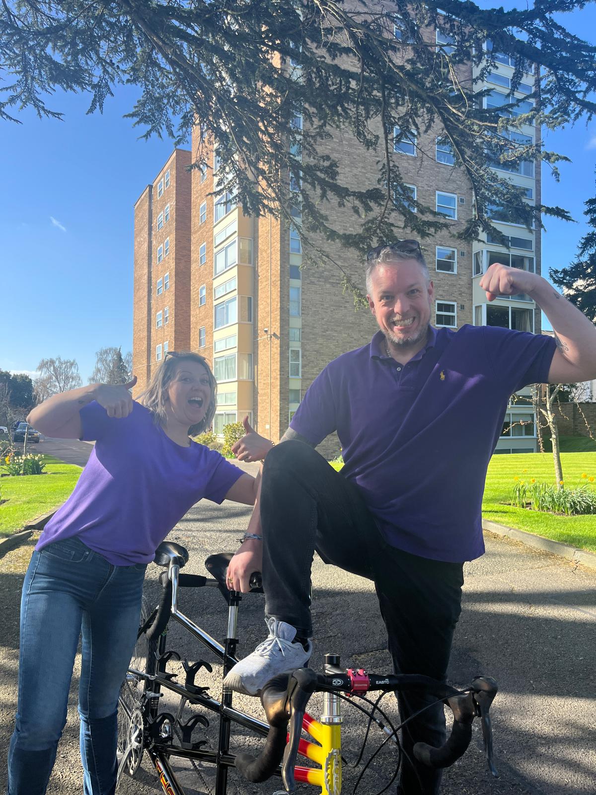 Picture of Fraser Nicoll with Louise Williams acting a little crazy after buying a tandem bike to support blog post What ADHD Coaching Is and How to Find a Coach 