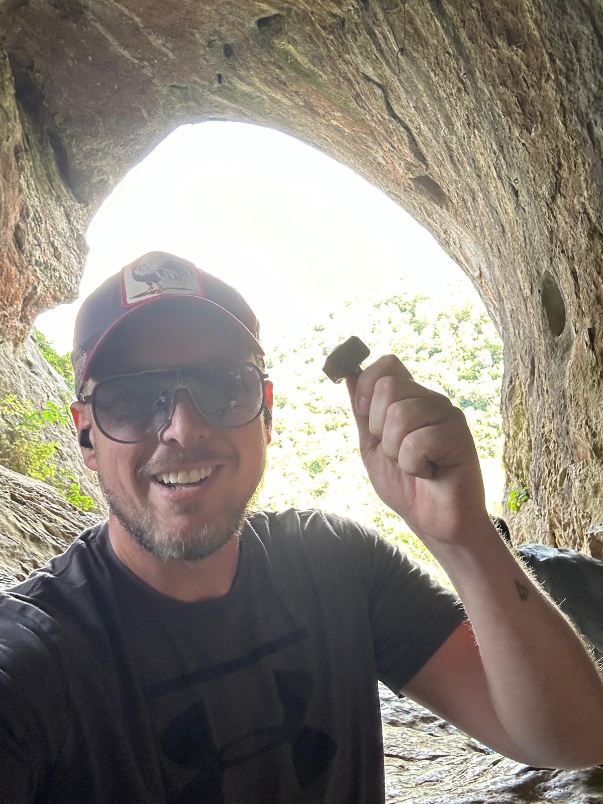 Fraser Nicoll in Thors cave with a Thor Hammer to support blog post What ADHD Coaching Is and How to Find a Coach