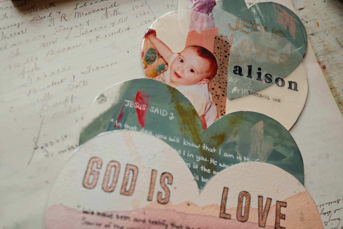 The God is Love heart with watercolor rings on aged paper