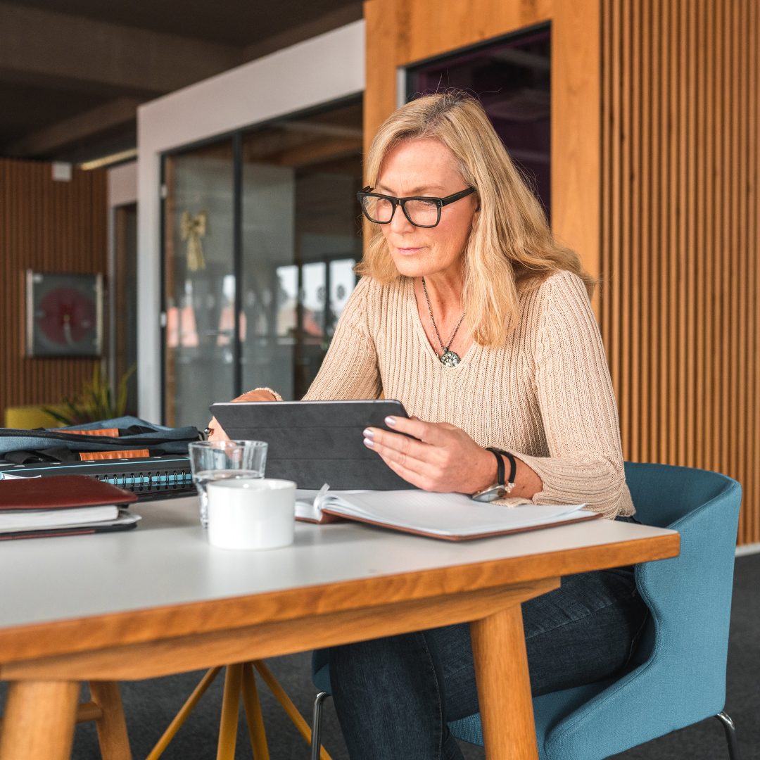 Lady at table working on laptop