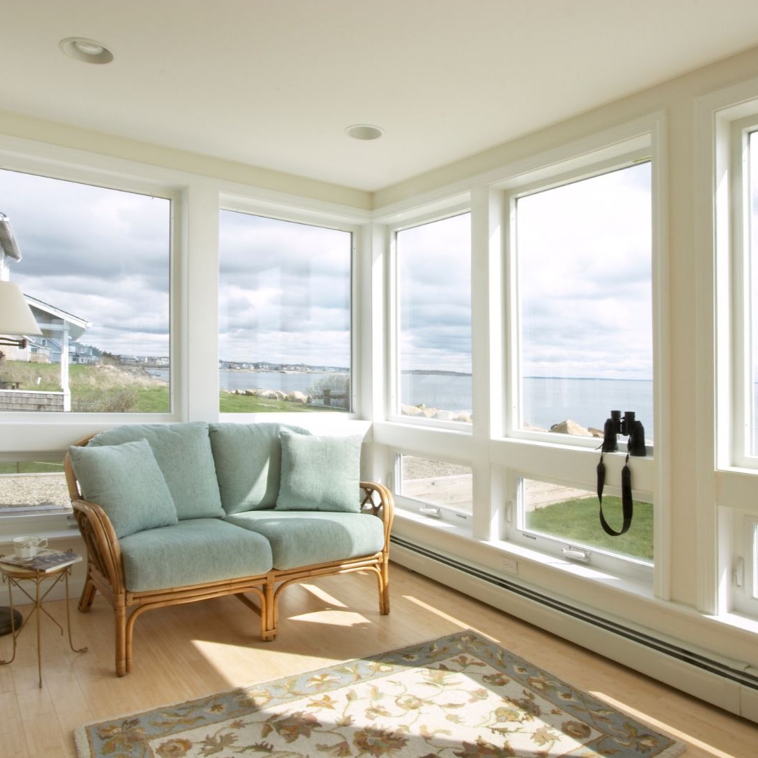 Bright sunroom home addition with ocean view windows in Irving, TX