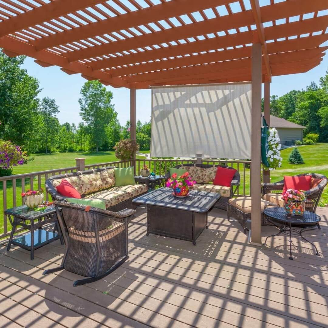 Custom-built pergola patio cover in Irving, TX featuring outdoor seating, sun shade, and backyard landscaping for added comfort and style.