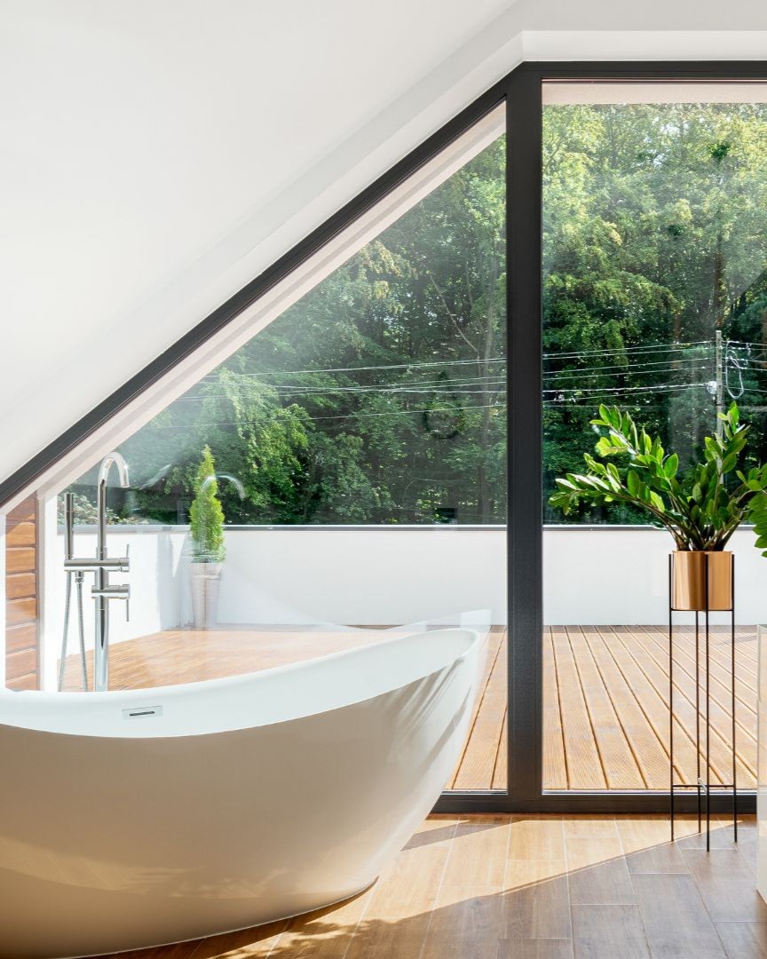 Modern bathroom remodel in Flower Mound TX with freestanding tub and large window design.