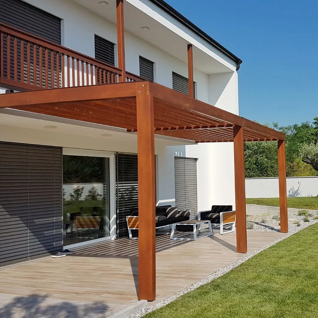 Cedar pergola attached to a home over a backyard patio in Wylie, TX