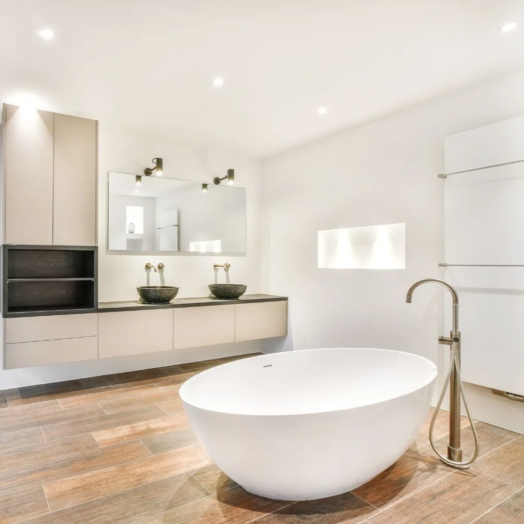 Modern bathroom remodel in Coppell, TX with floating vanity and freestanding tub