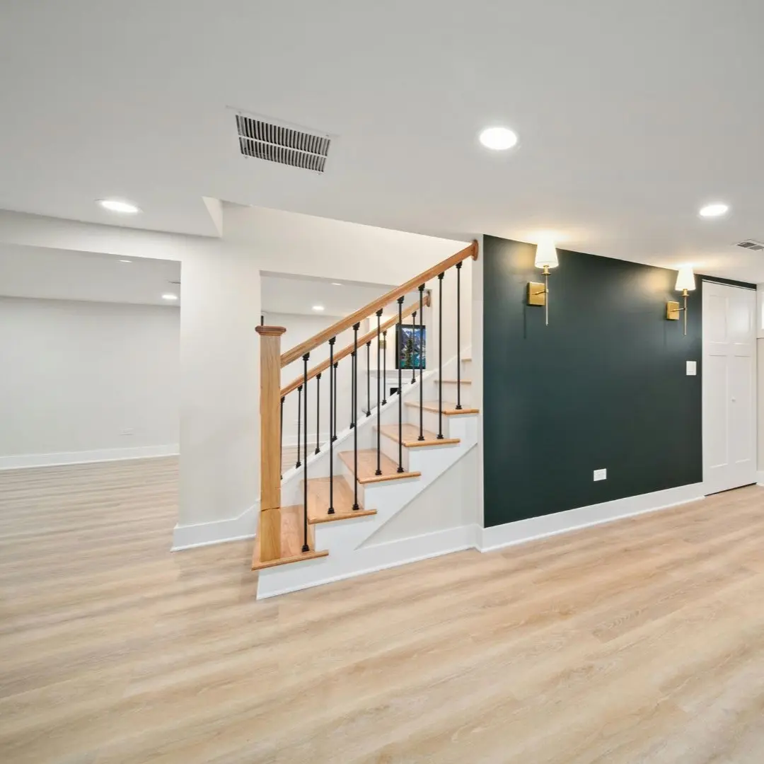 Interior remodel with new stairs, accent wall, recessed lighting, and LVP flooring in Farmers Branch, TX