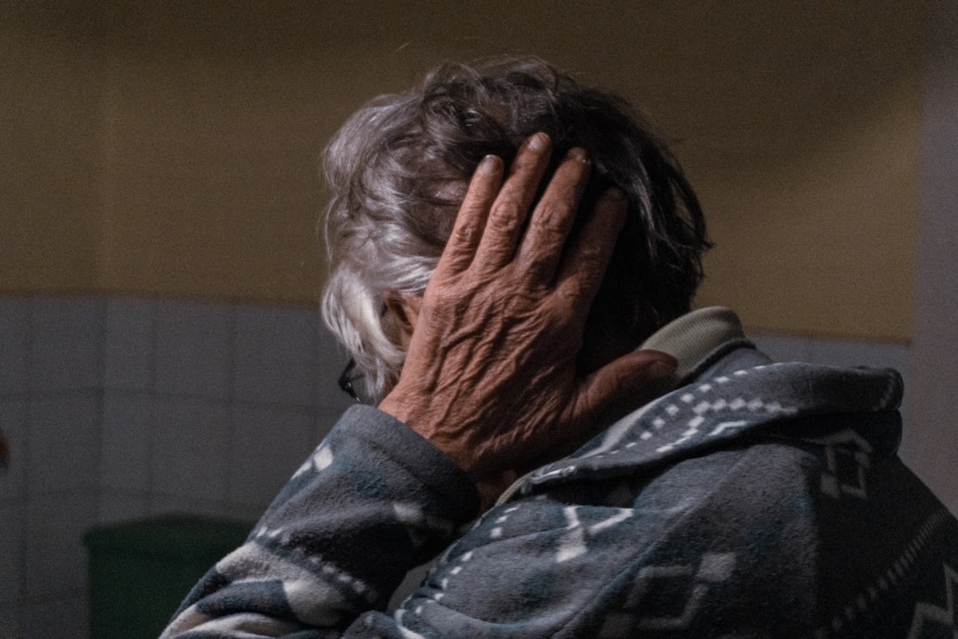 A concerned adult child speaks gently with an aging parent at the kitchen table—capturing the emotional complexity of helping seniors accept care. A concerned adult child speaks gently with an aging parent at the kitchen table—capturing the emotional complexity of helping seniors accept care.