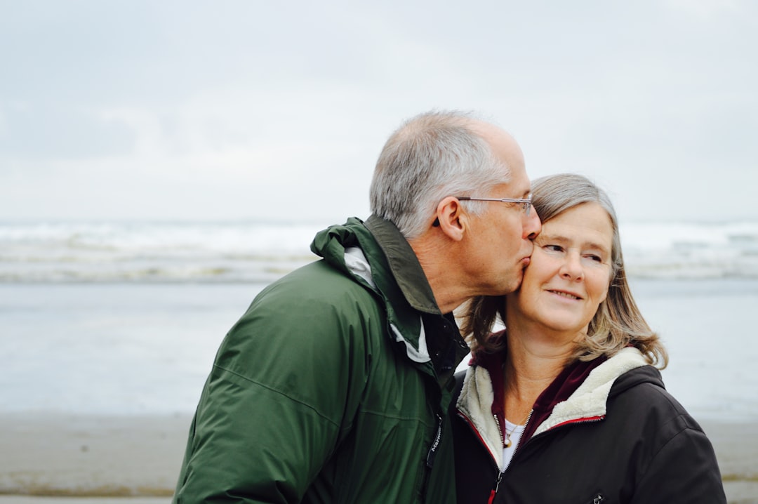 Older adult reviewing life insurance documents with family to explore a life settlement for care funding