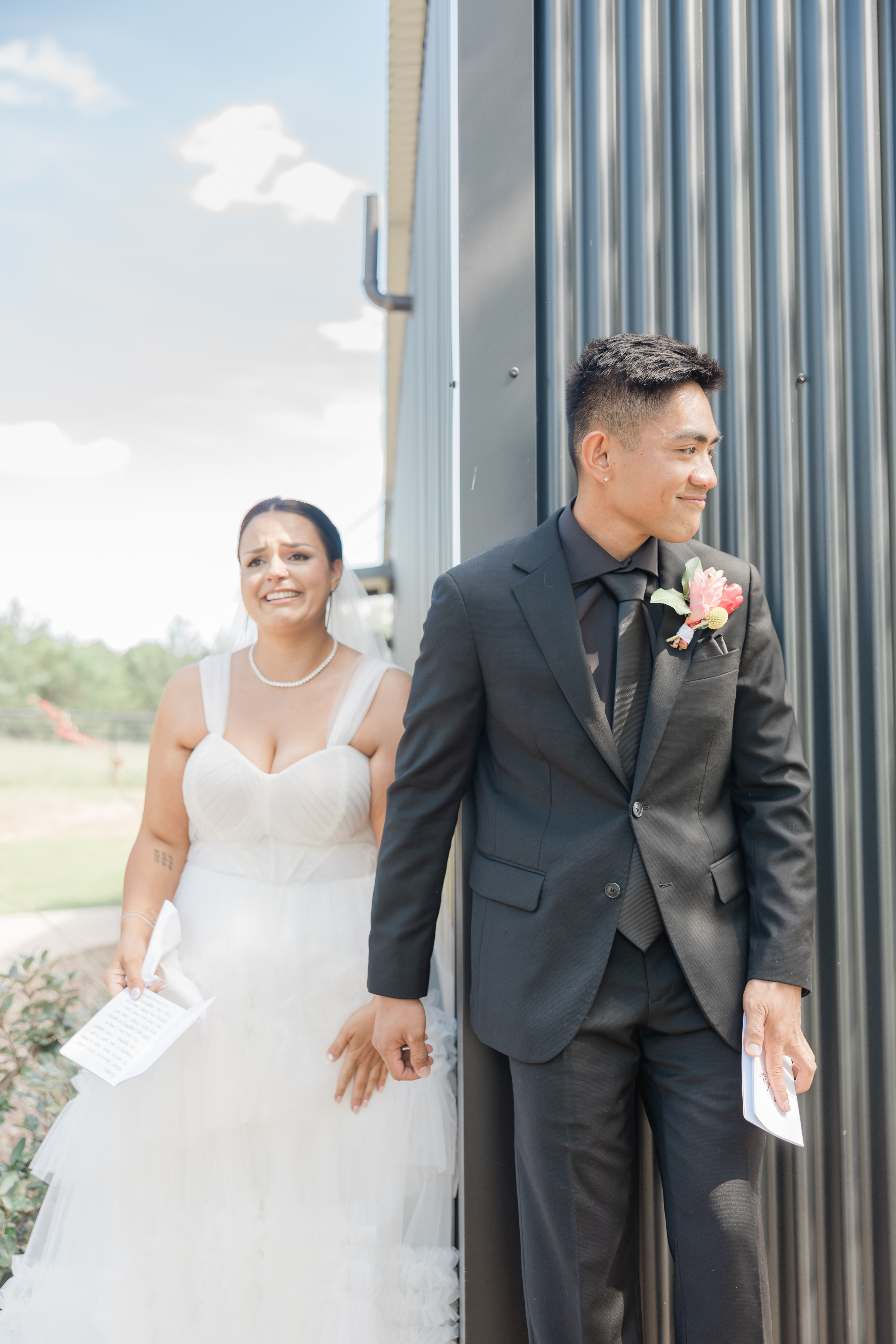 A tender moment between a bride and groom during their private vows & first touch. Emotions are evident on the brides face as her groom reads his vows to her in this candid wedding portrait captured by Dallas wedding photographer, Arlene Stepanian Photography.