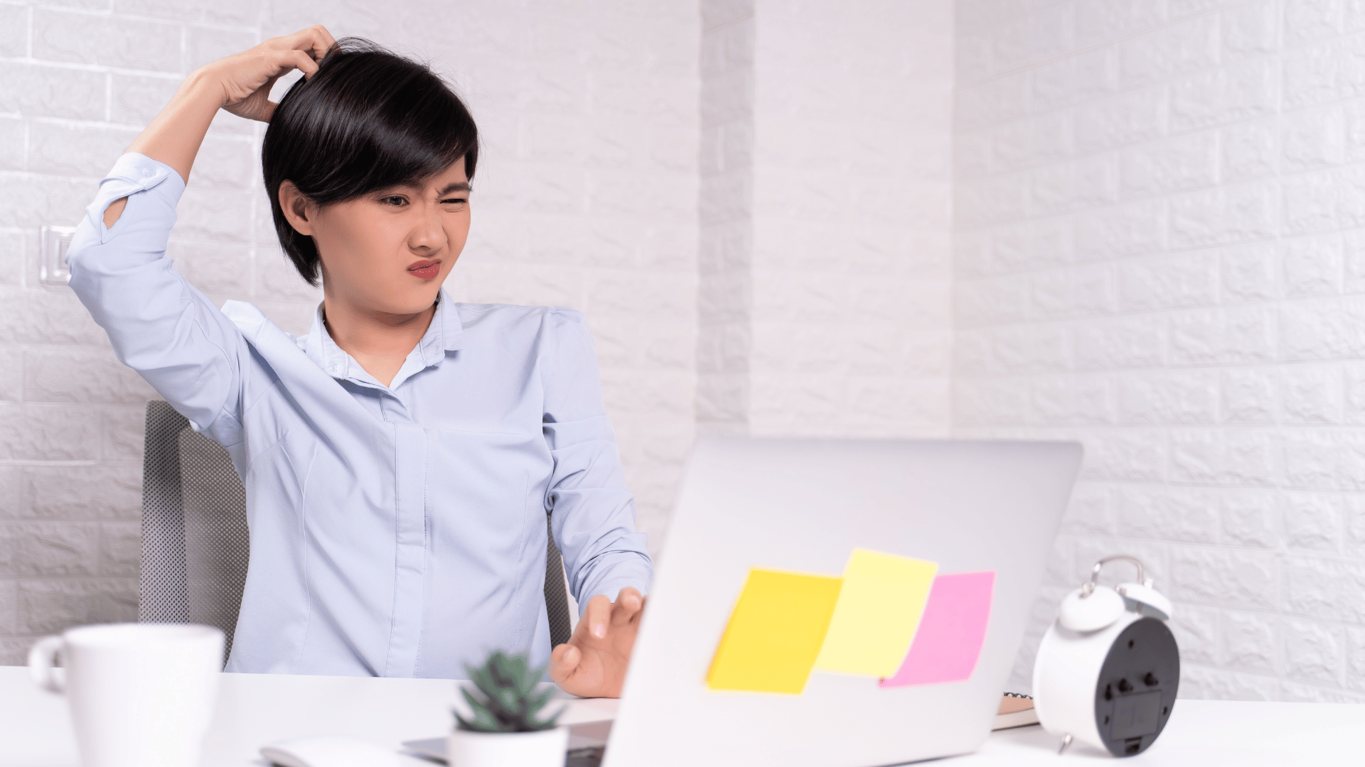 Woman scratching head Woman scratching head