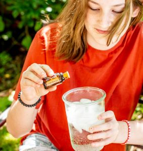 teen holding wild orange