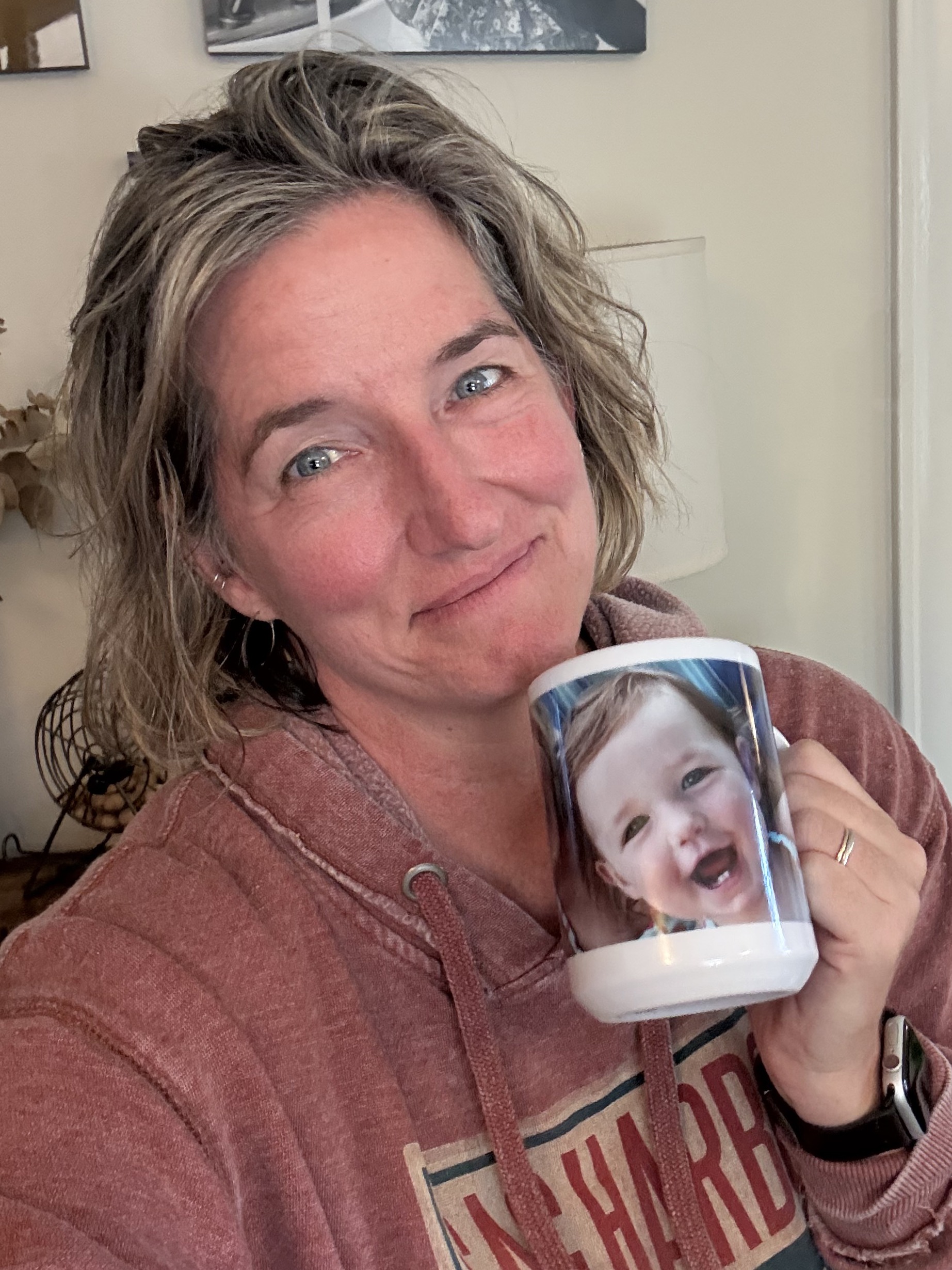 Jess Holding a Mug with a Photo on it