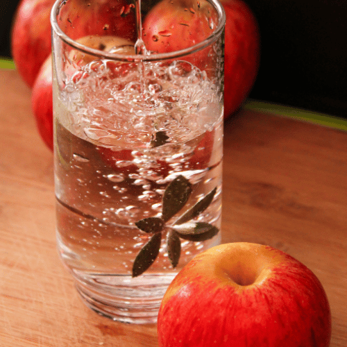 glass of water and apples