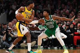 Marcus Smart defending a basketball player NBA