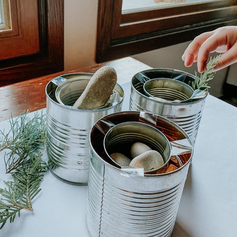 Cans are filled with stones and rosemary Cans are filled with stones and rosemary