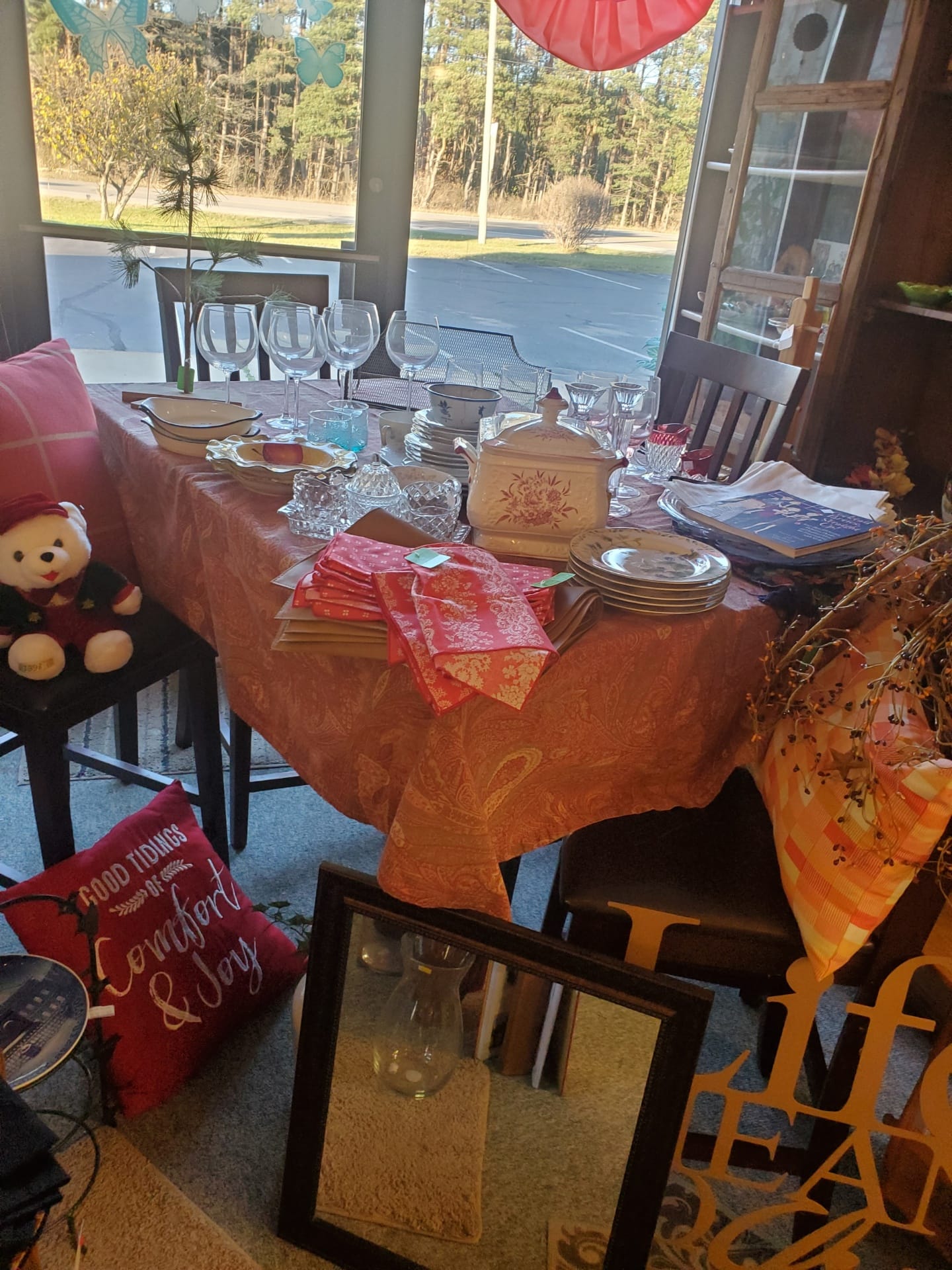 A table set with various kitchen wares for resale