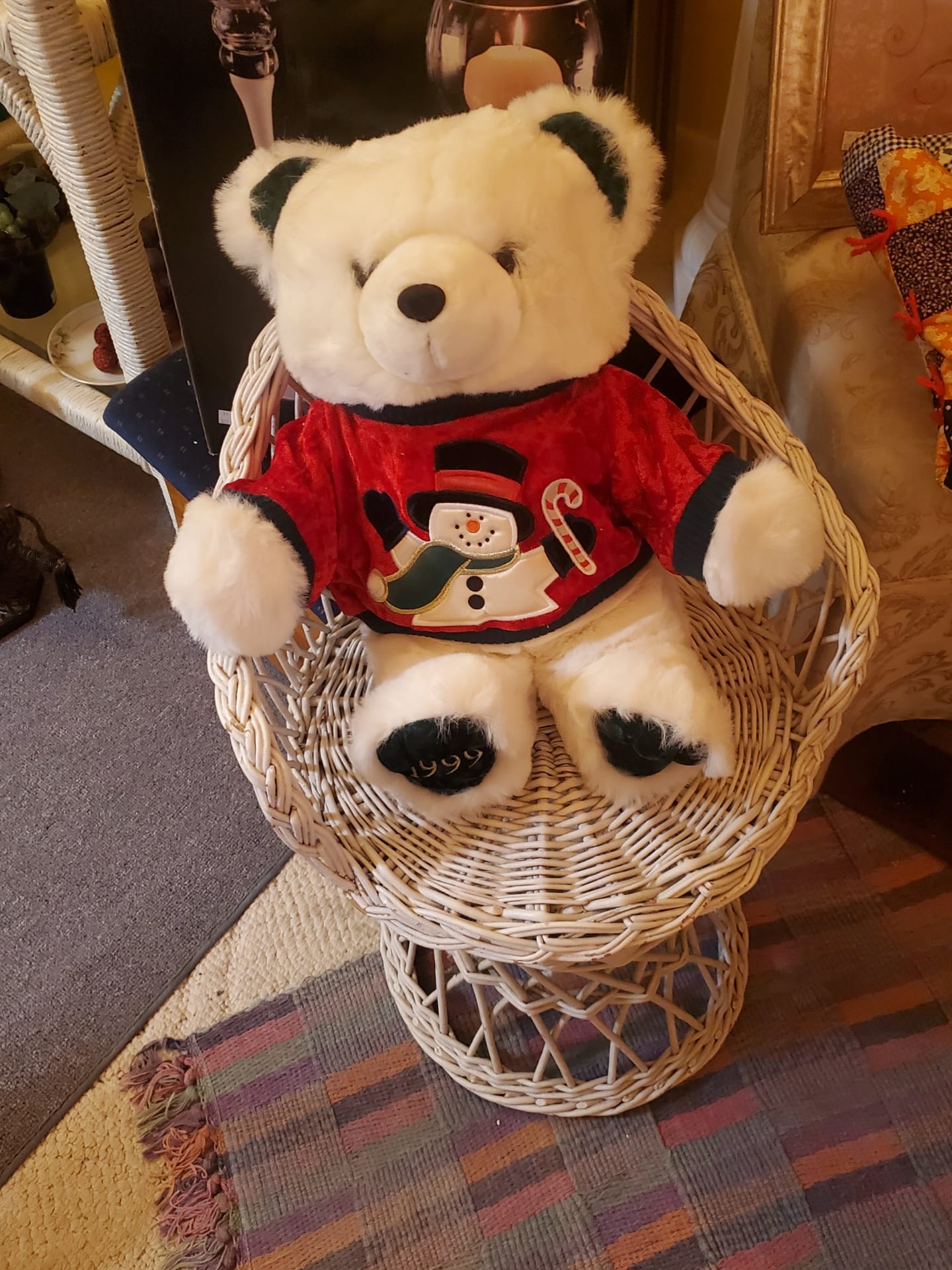 A cute teddy bear and a wicker chair for resale
